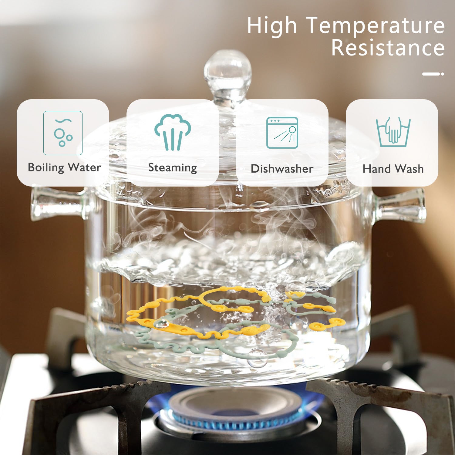 Glass container being tested for high temperature resistance with icons indicating boiling water, steaming, dishwasher, and hand wash.