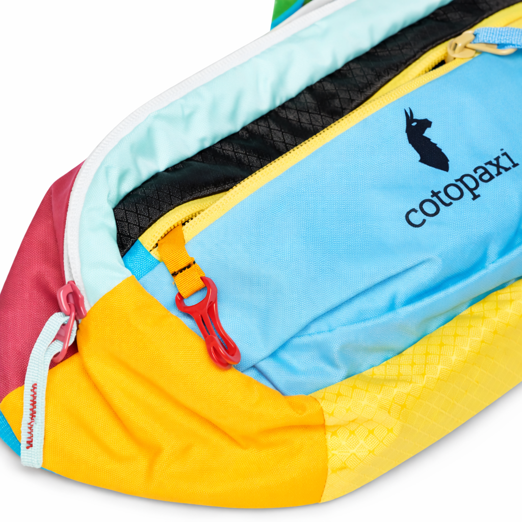 Colorful waist bag with 'cotopaxi' branding on a white background