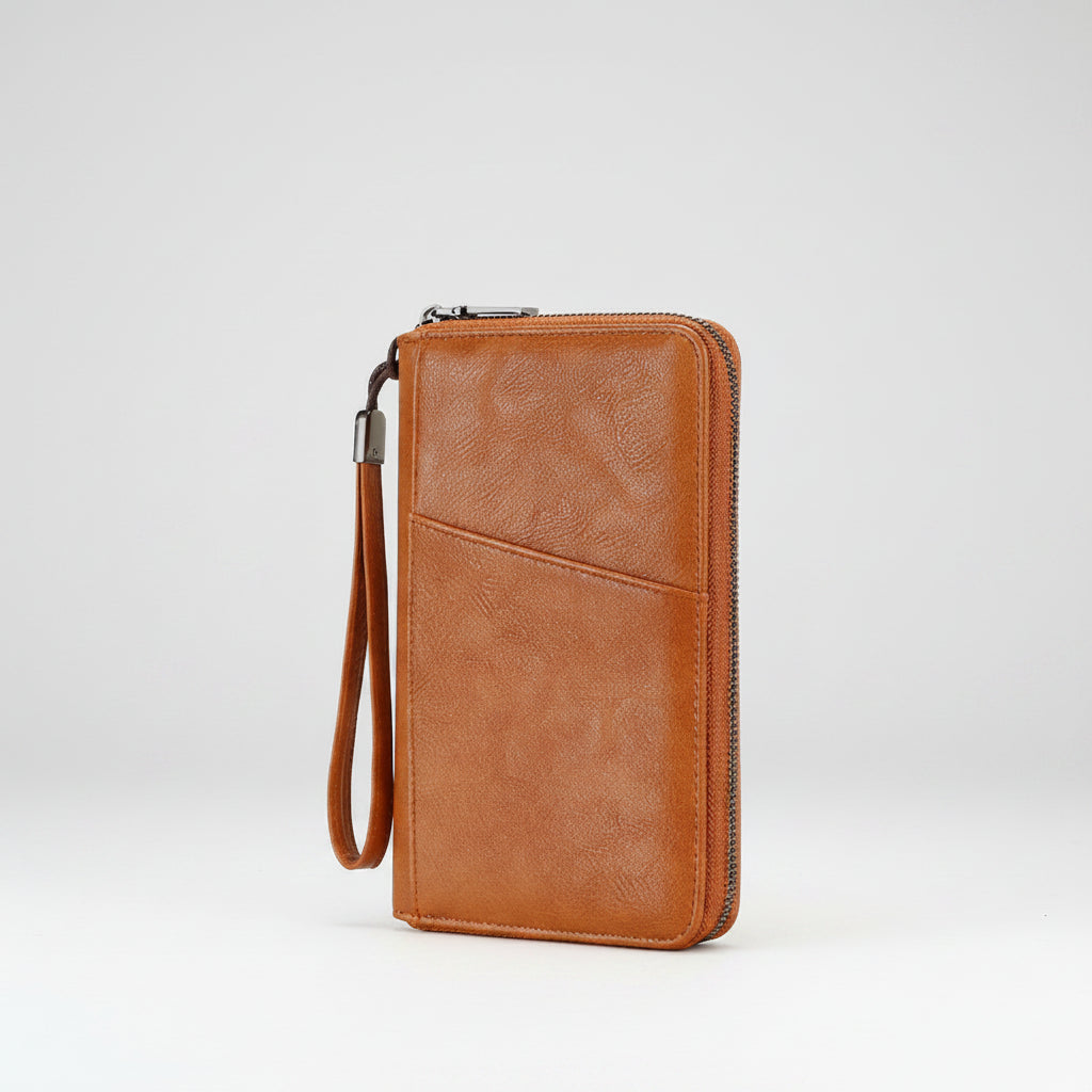 Brown leather wallet with a wrist strap on a white background