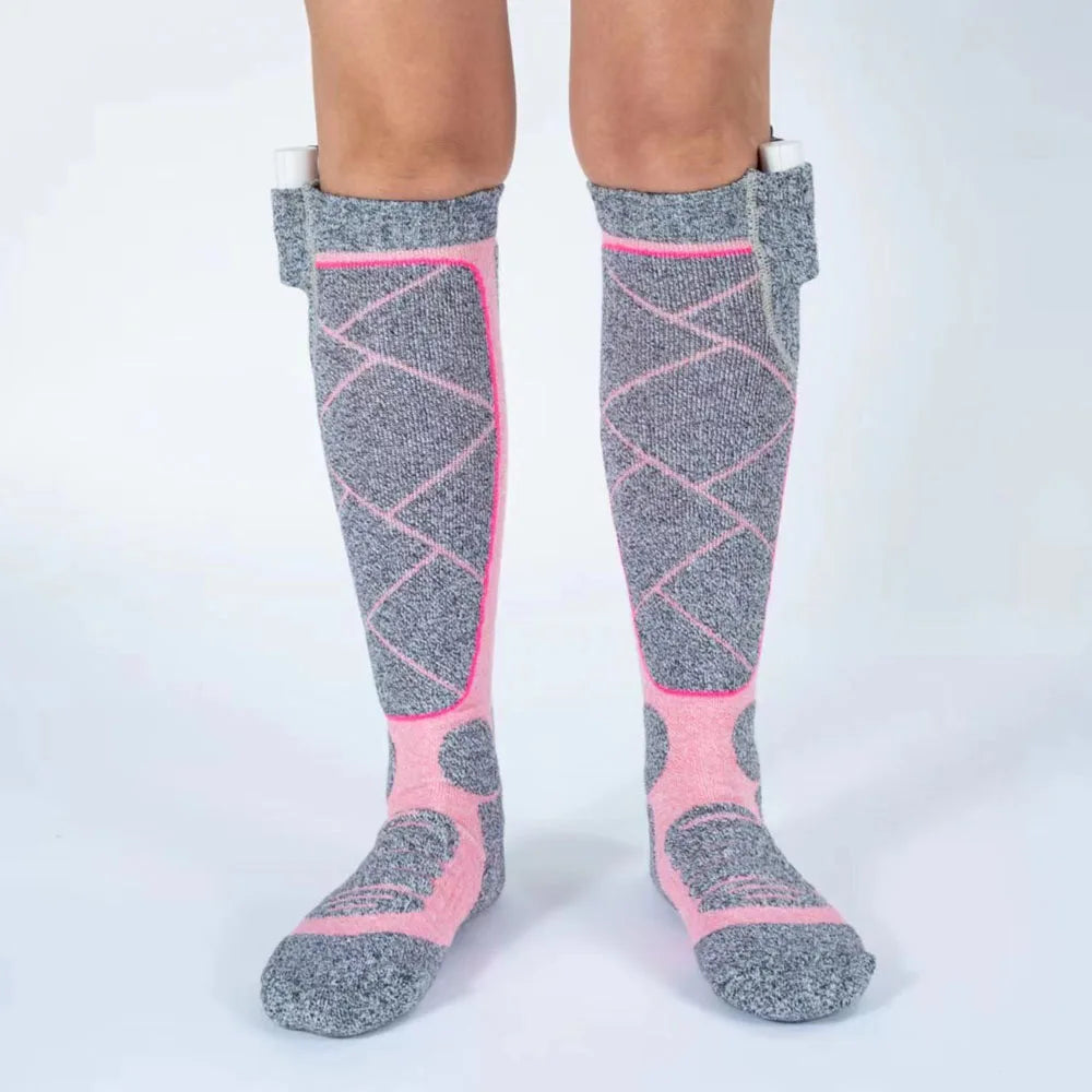 Gray and pink knee-high socks on a white background