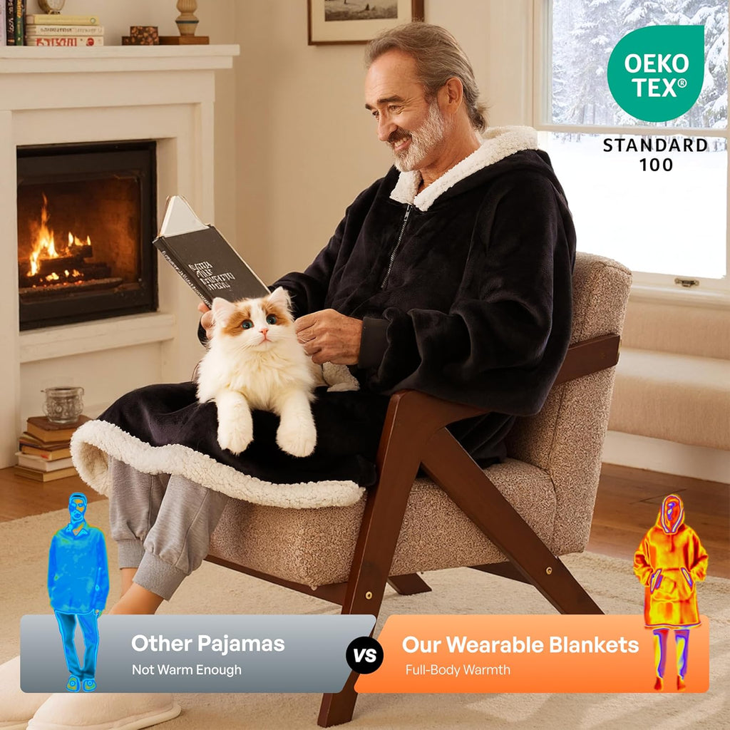 Product image of CozyNest wearable blanket hoodie Man in a black sherpa robe with a cat sitting on a chair, with Oeko-Tex Standard 100 logo.