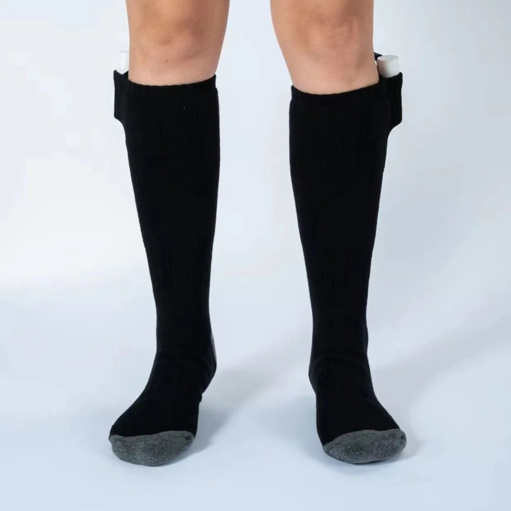Black knee-high socks with gray toes on a white background