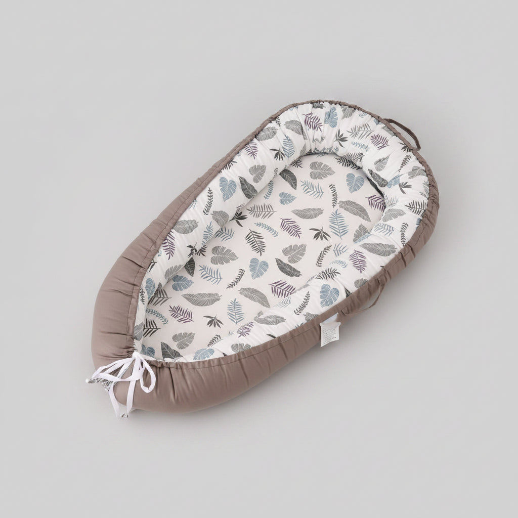 Baby nest with leaf pattern on a white crib