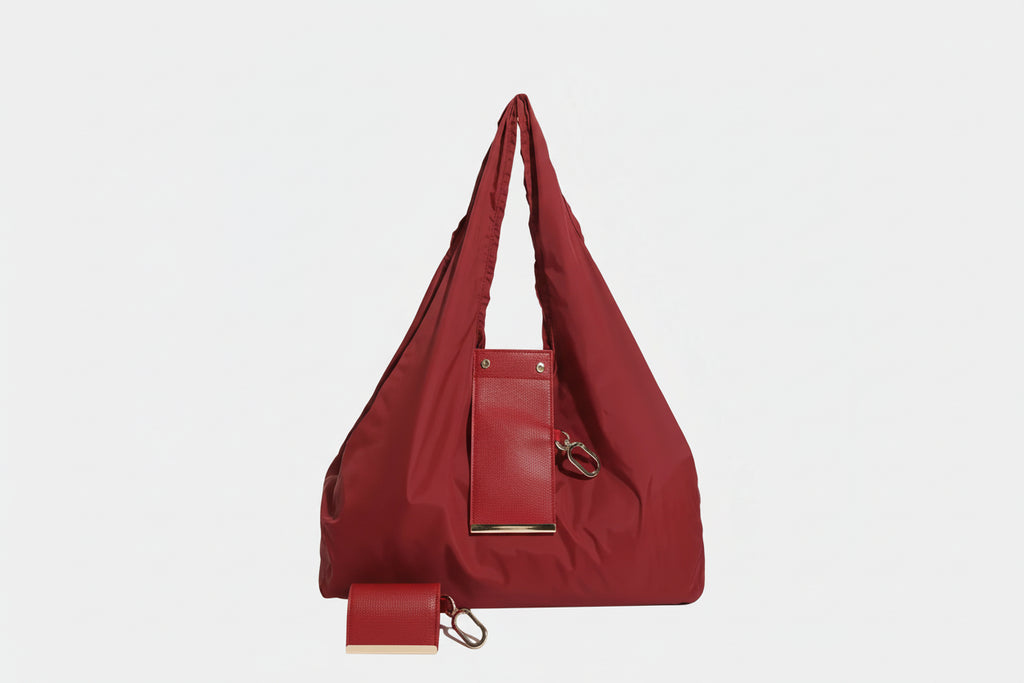 Red handbag with matching wallet on a white background