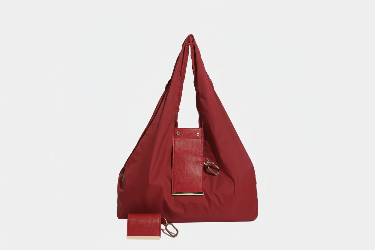 Red handbag with matching wallet on a white background