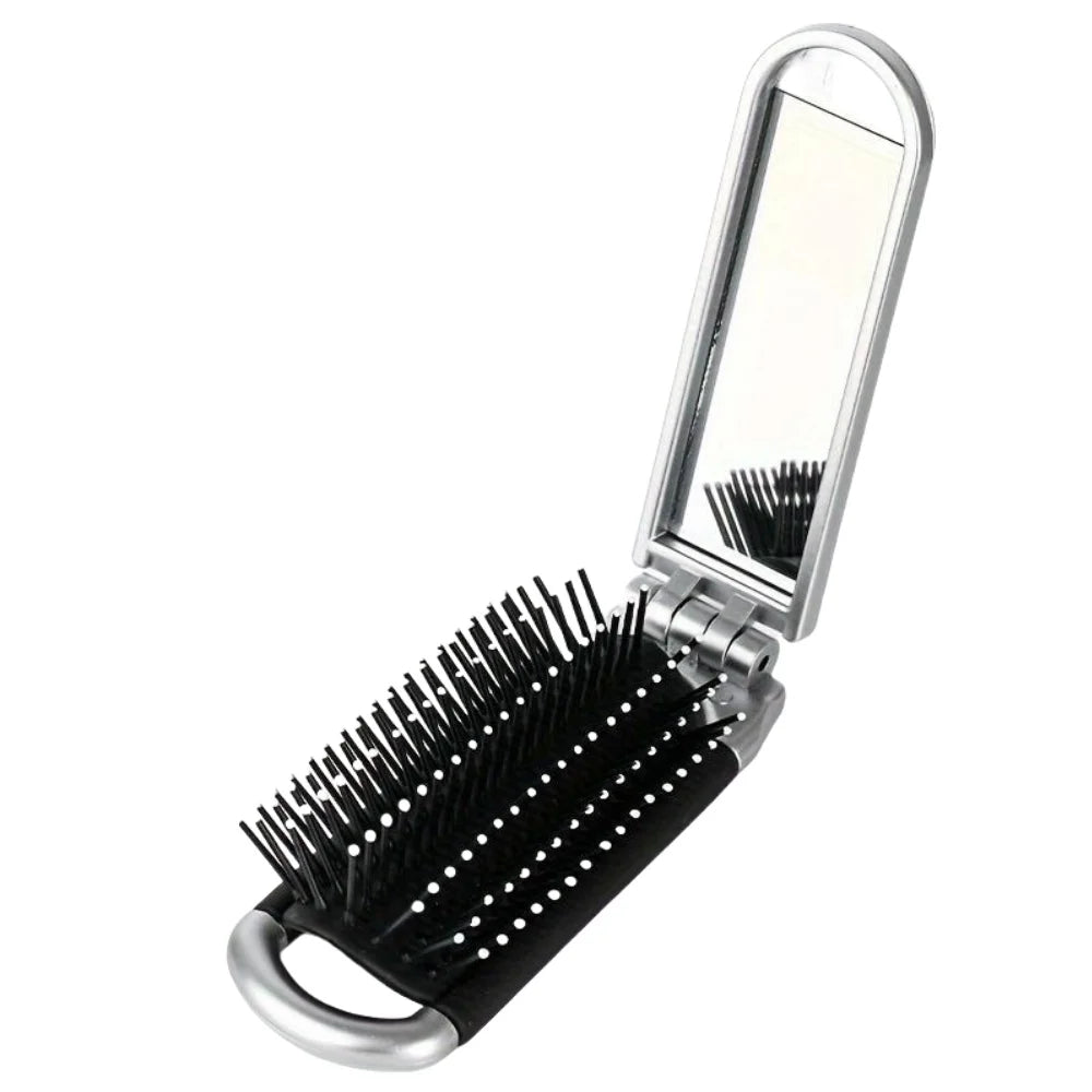 Hairbrush with built-in mirror on a white background silver