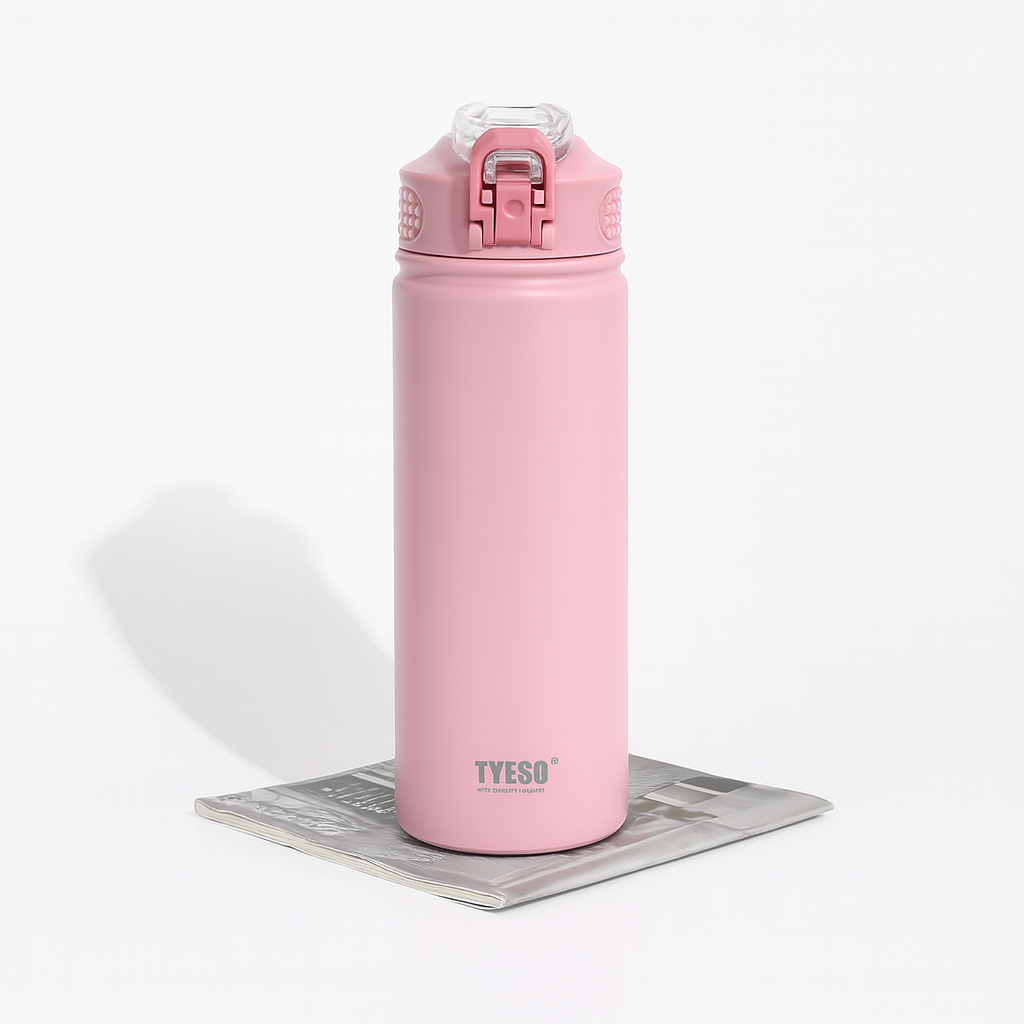 Pink water bottle with a white background