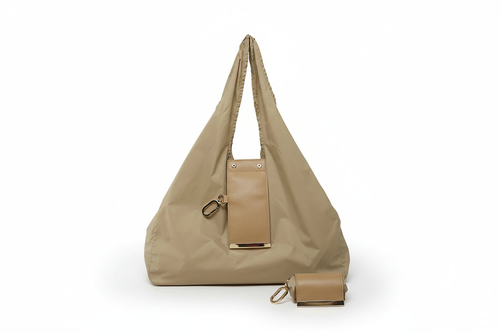 Beige handbag with matching pouch on a white background