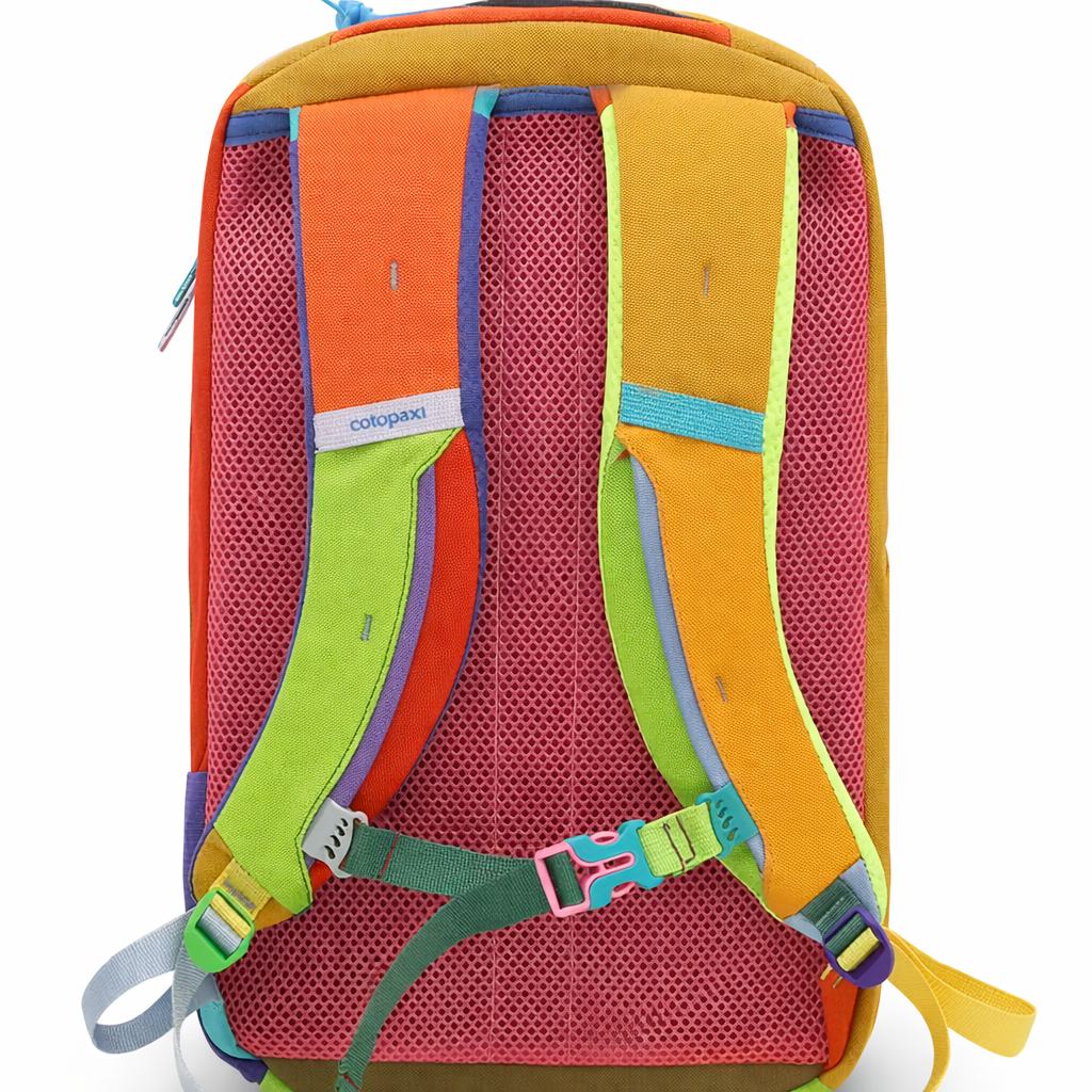 Colorful backpack with multiple straps and a visible brand label - travel essentials
