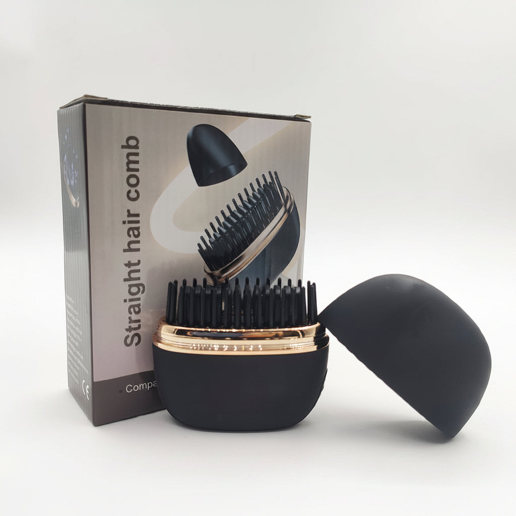 Black hair comb with gold accents on a white background