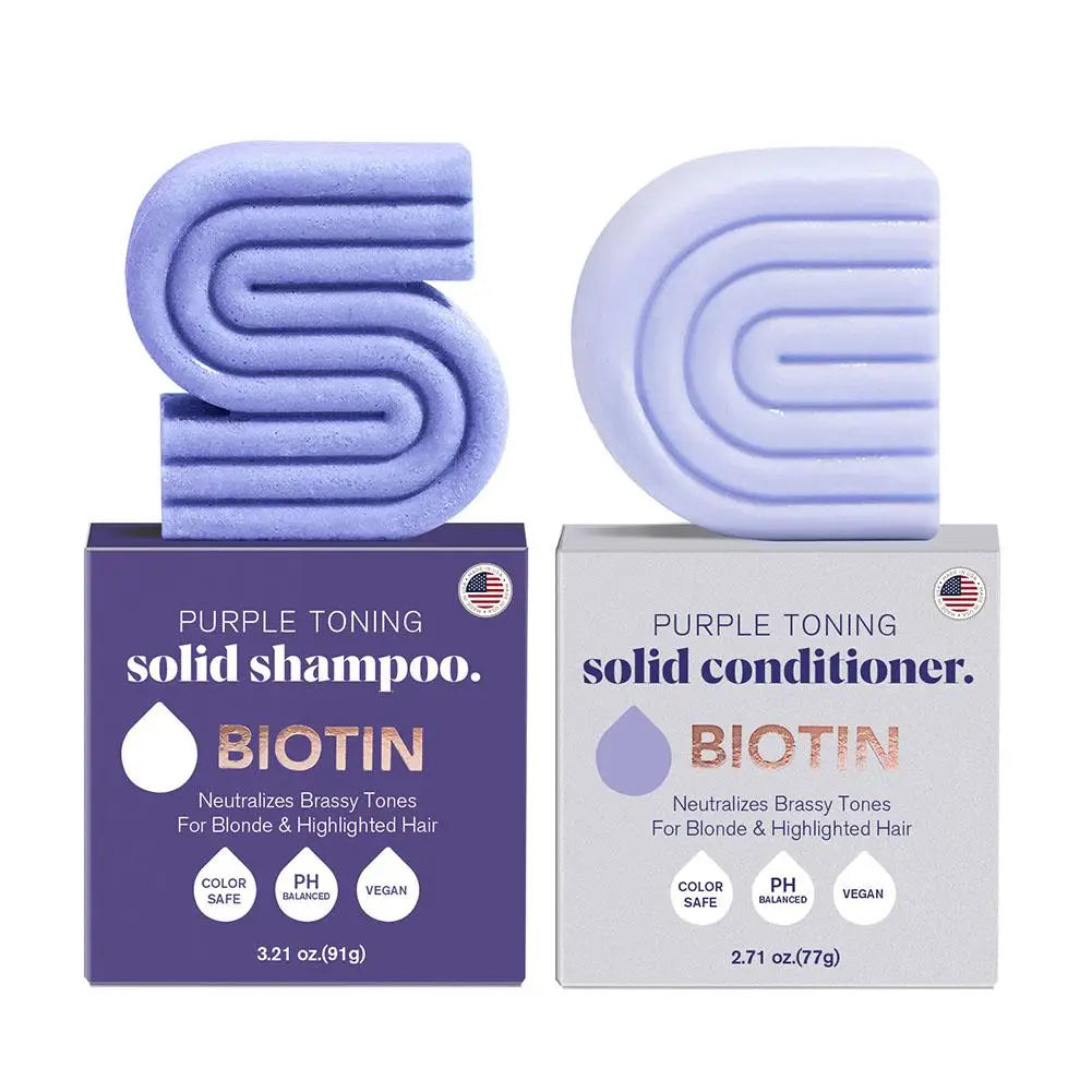 Product image of Purple-toning solid shampoo and conditioner bars with packaging on a white background