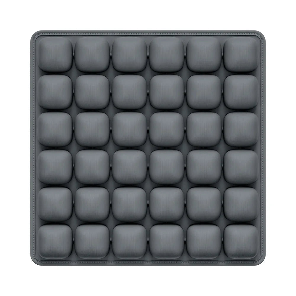 Gray silicone ice cube tray on a white background
