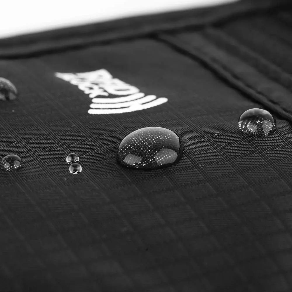 Close-up of water droplets on a textured black surface with a white logo.