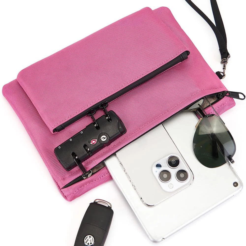 Pink drawstring bag with phone, sunglasses, and other items on a white background