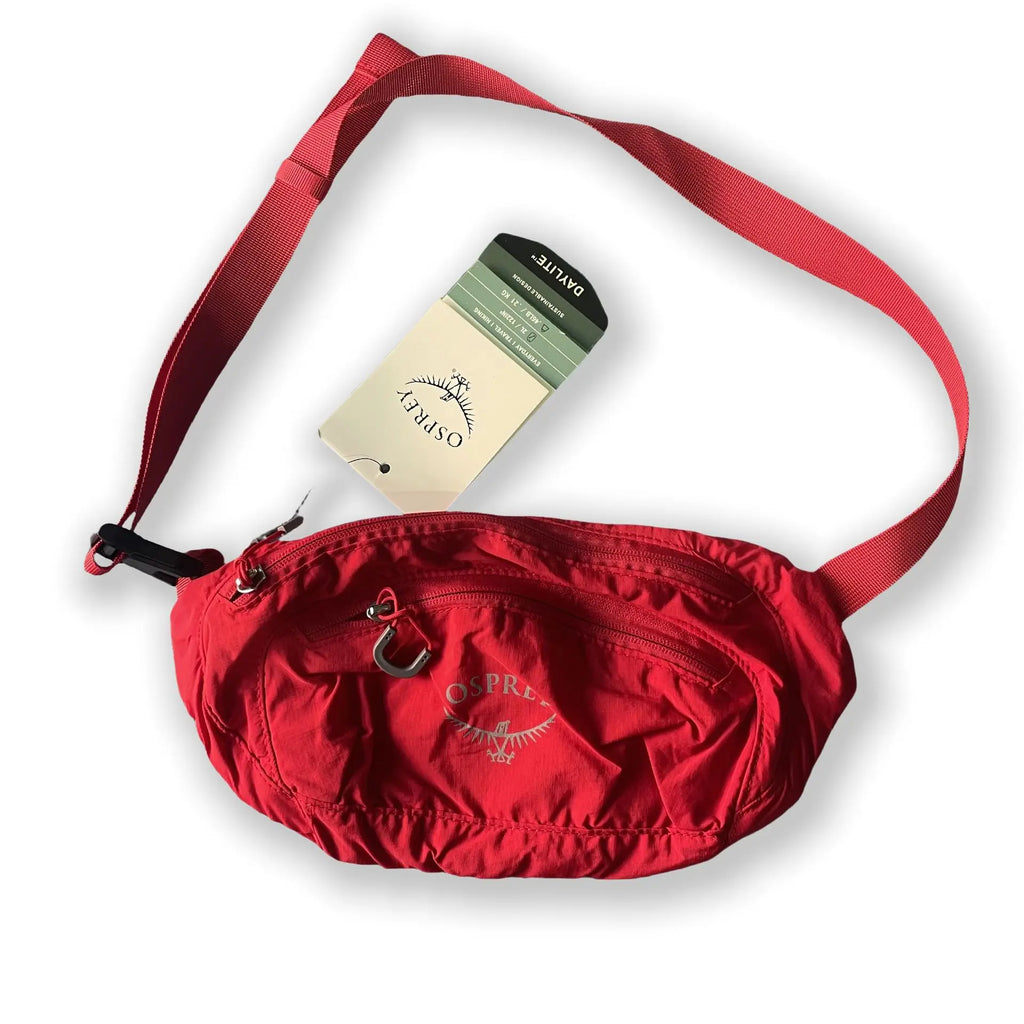 Product image of Red Osprey waist pack with a visible brand tag on a white background