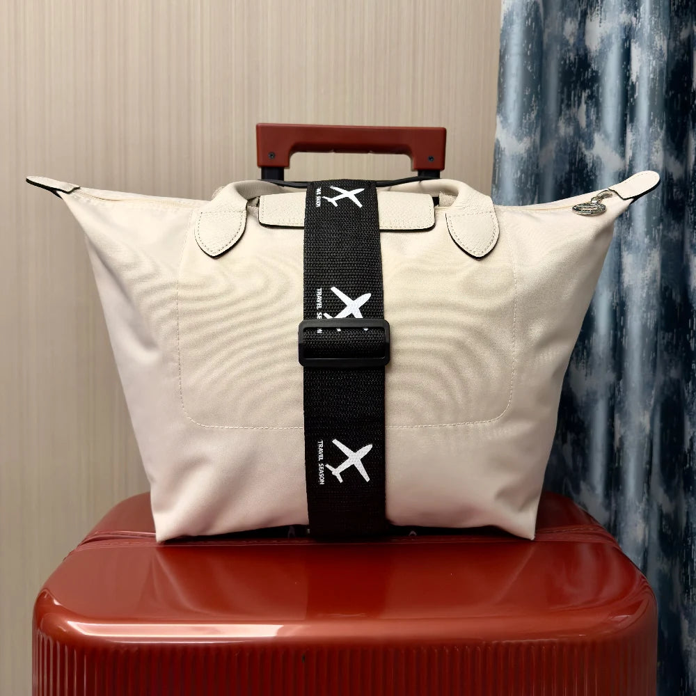 Lifestyle photo of a traveller using the BagLink Travel Luggage Connector Strap on the go - travel accessories Australia