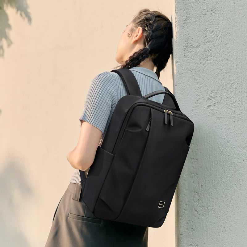 NovaWork backpack being worn on shoulder lifestyle view airport commuter travel