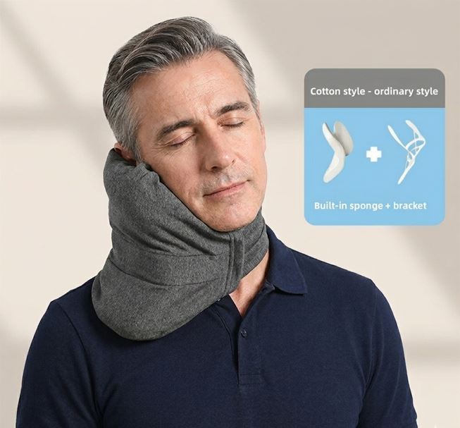 Man wearing a gray travel neck pillow with an inset diagram on a beige background