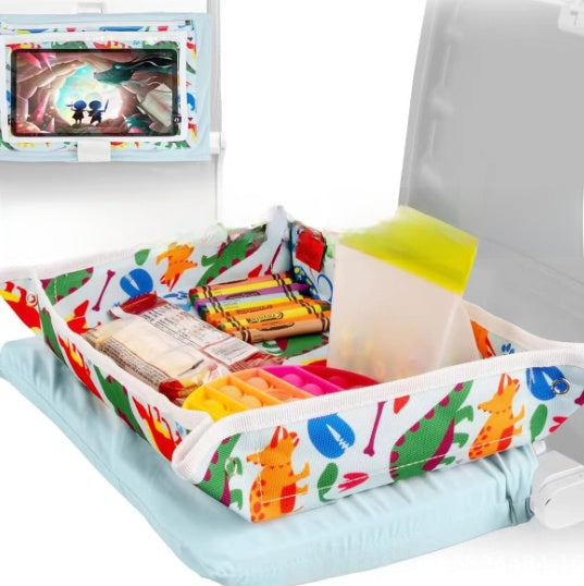 Colorful tray with stationery items on a chair, featuring a tablet displaying an animated scene.