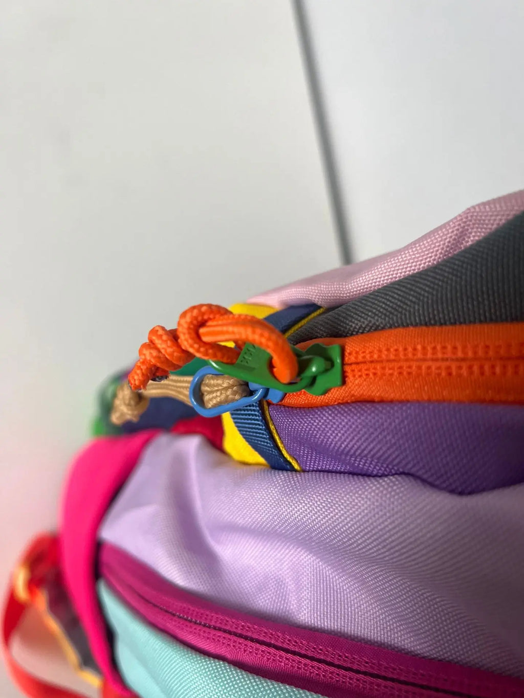 Colorful bag with a zipper and decorative elements - travel luggage