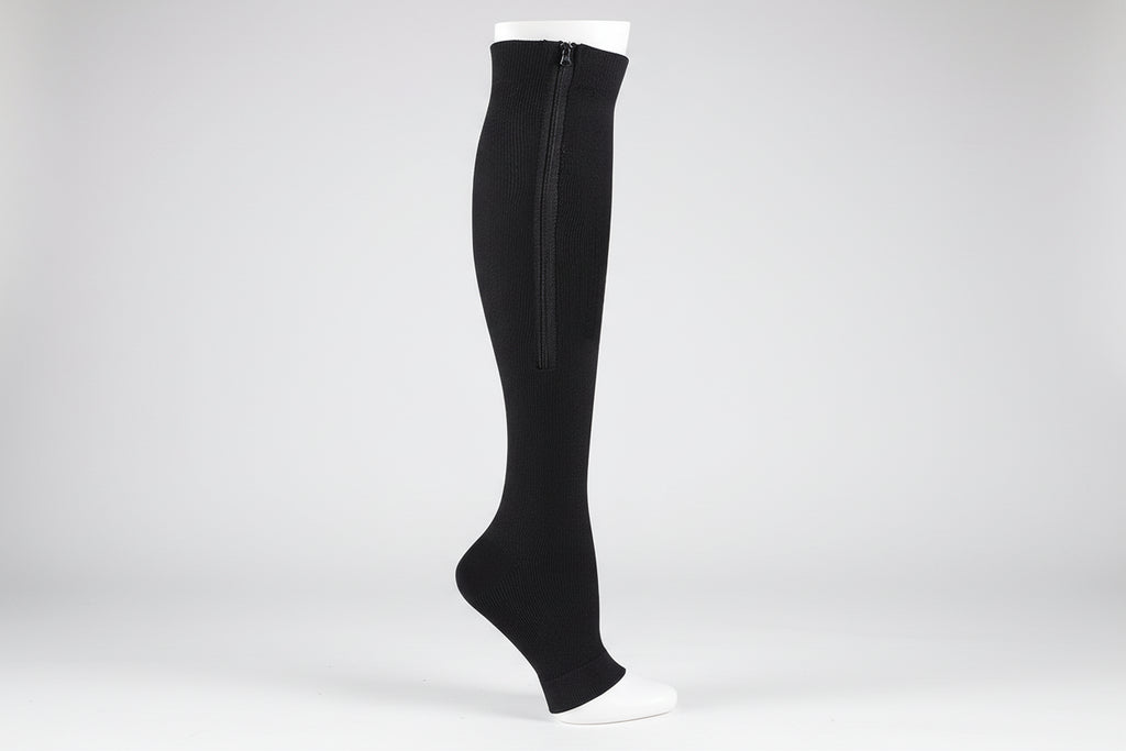 Black knee-high sock with a zipper on a white background