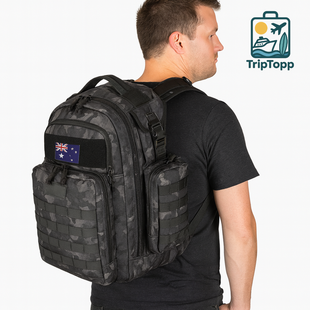 Man wearing a black backpack with a visible TripTopp logo. actical dad diaper backpack with insulated bottle pockets