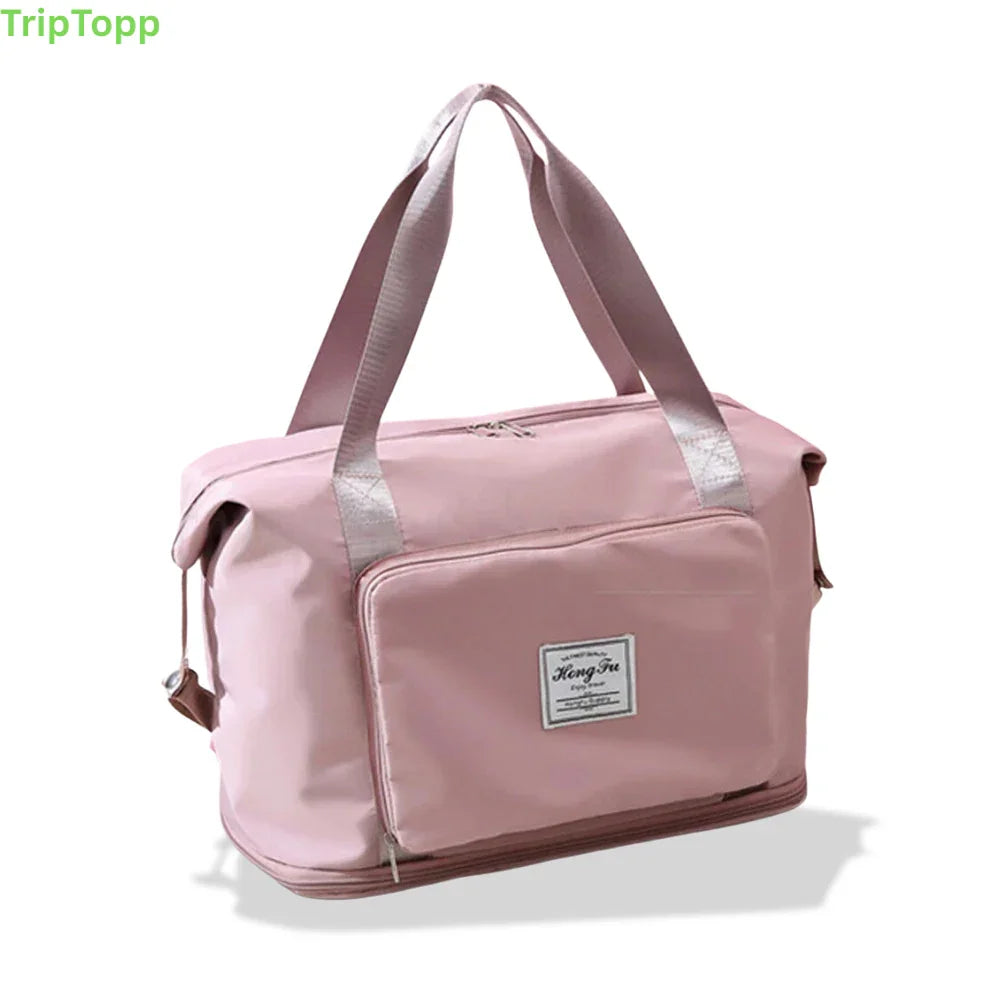 Pink duffel bag with visible brand logo - travel essentials