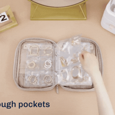 Open Jewelry Travel Organizer displaying interior compartments and storage layout - travel luggage