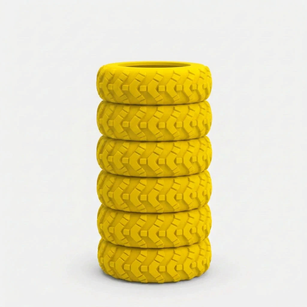 Yellow silicone luggage wheel protector fitted on a suitcase wheel, with spare covers shown below