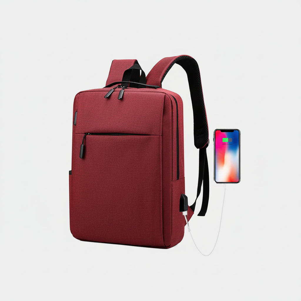 Red backpack with USB cable and smartphone on a white background