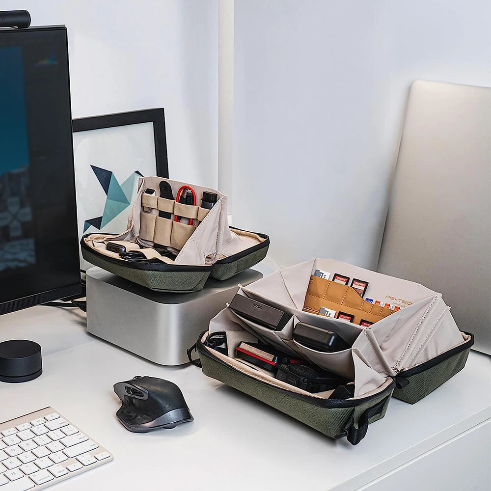 product front view CarryOn Tech Organizer Desk organizer with compartments on a desk next to a computer monitor and keyboard.