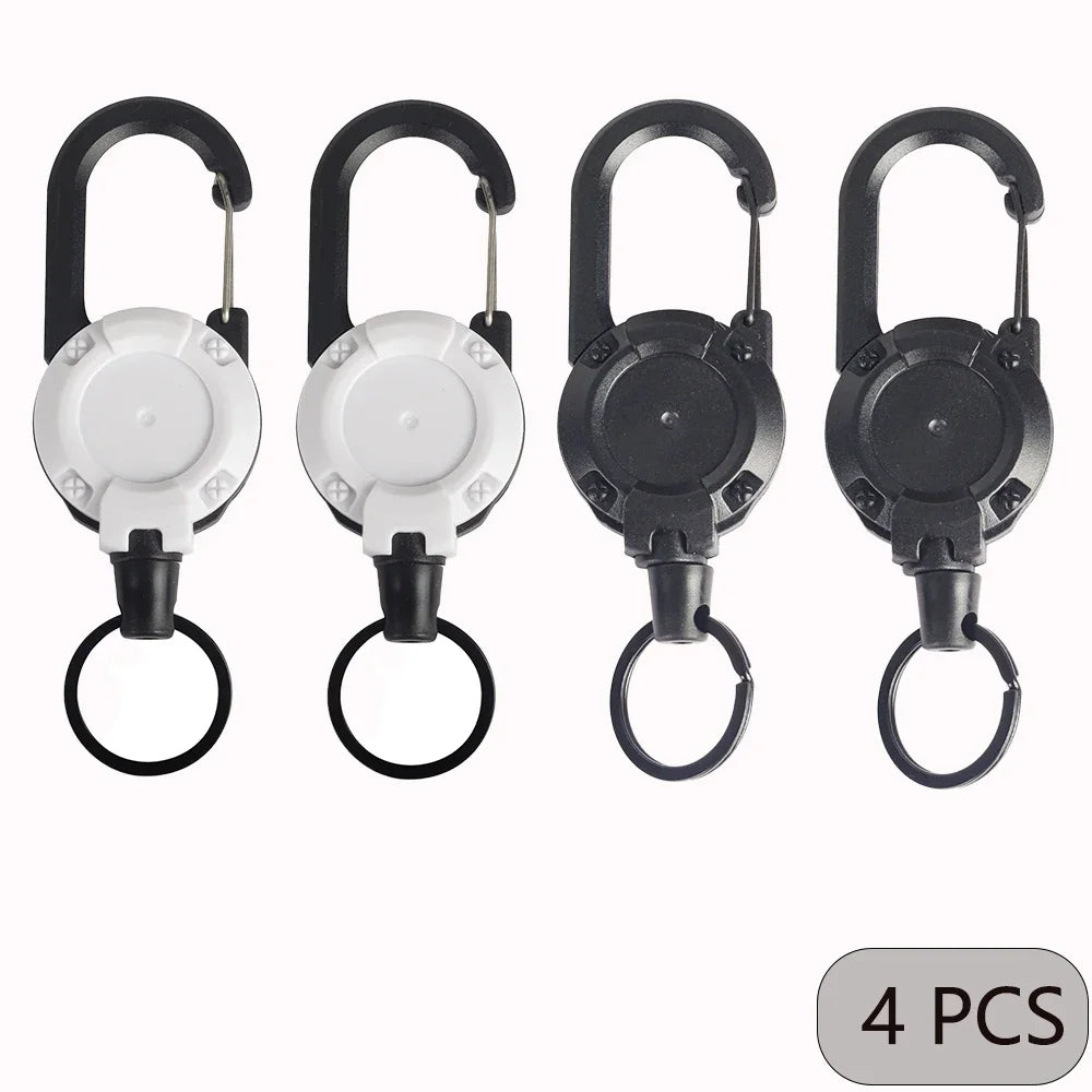 Four-pack of white and black retractable keychains with carabiner clips